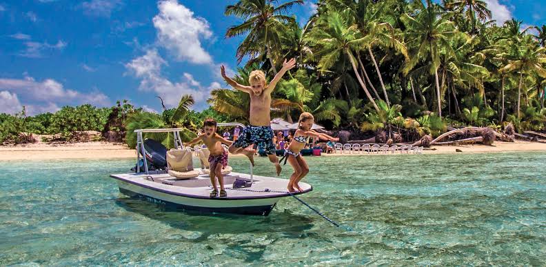 Family enjoying a Seychelles beach